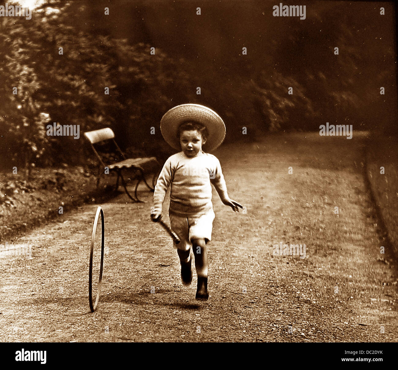Boy with hoop and stick Victorian period Stock Photo - Alamy