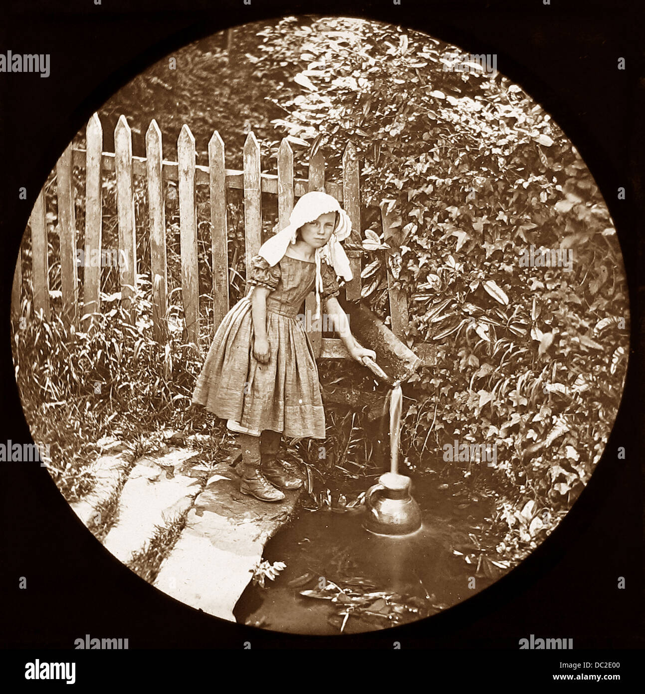 Girl fetching water Victorian period Stock Photo