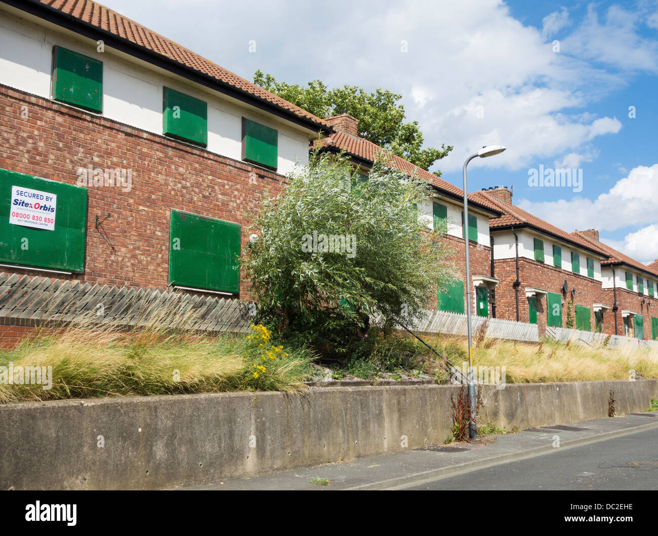 Row of boarded up houses a Swainby near Stockton on Tees, north east
