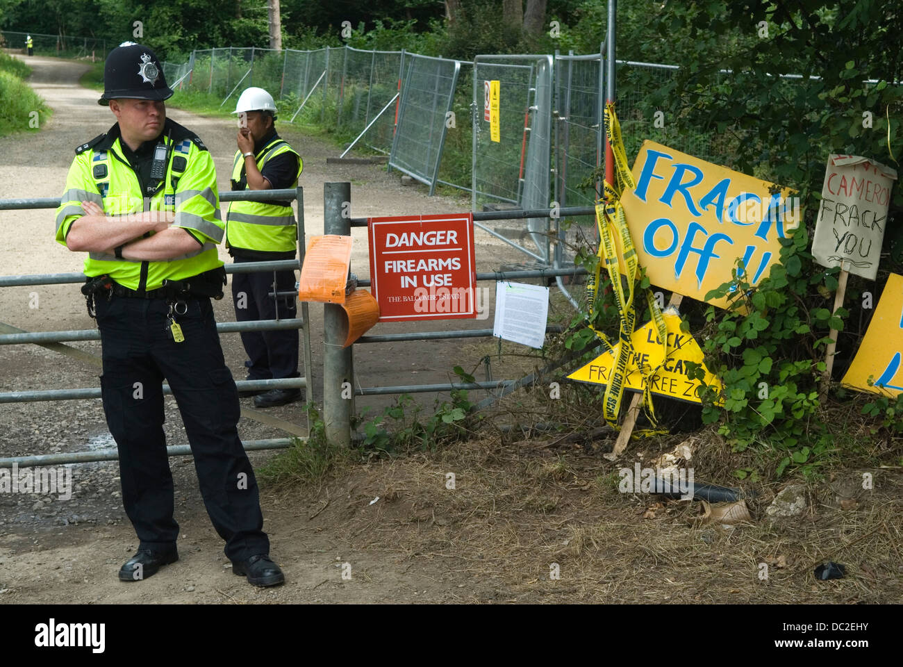 Balcombe West Sussex UK. Police and security guards, guard the Cuadrilla Resources site entrance, where Fracking is planned. 2013 2010sEngland HOMER SYKES Stock Photo