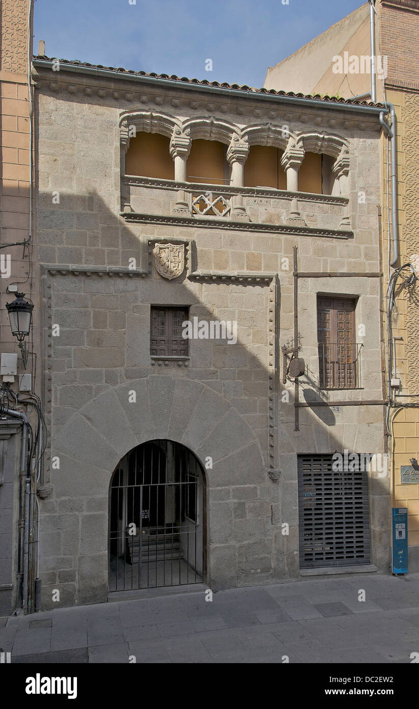 Sample of urban nobility residence of the 15th-century. CoA of the Tordesilla y Tapia's family, framed by a moorish arch, decorated with diamond points. The gallery was added in 1553. Segovia, Spain. Stock Photo