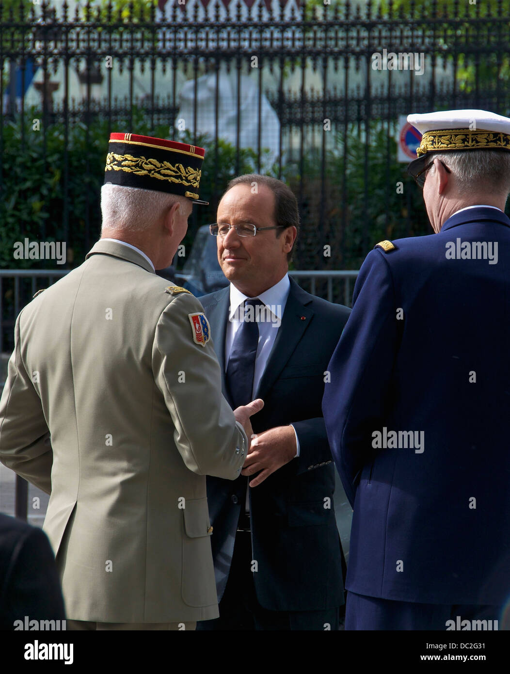 The french President François Hollande talking with Général d'Armée Bruno Dary, military Governor of Paris (left), and Admiral E Stock Photo