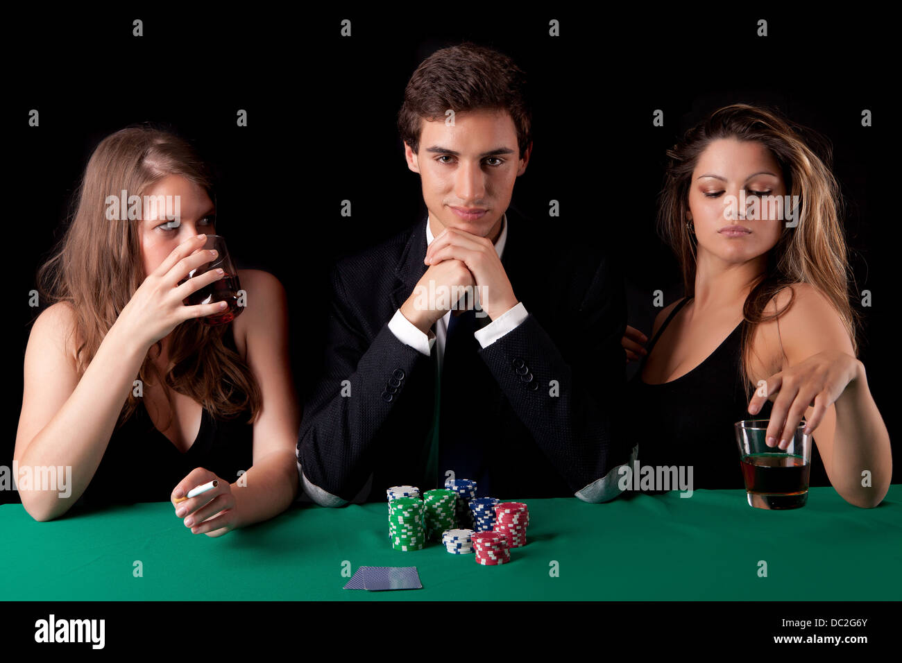 Young handsome man playing texas hold'em poker Stock Photo