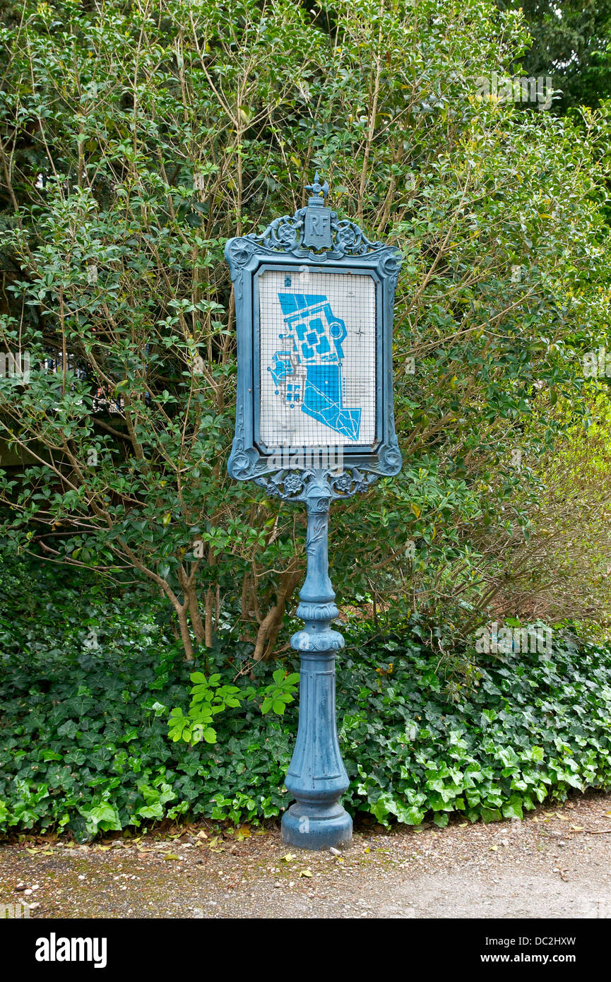 A sign in the 'Jardin de Diane' of the Château de Fontainebleau, with a map of castle and gardens. Stock Photo