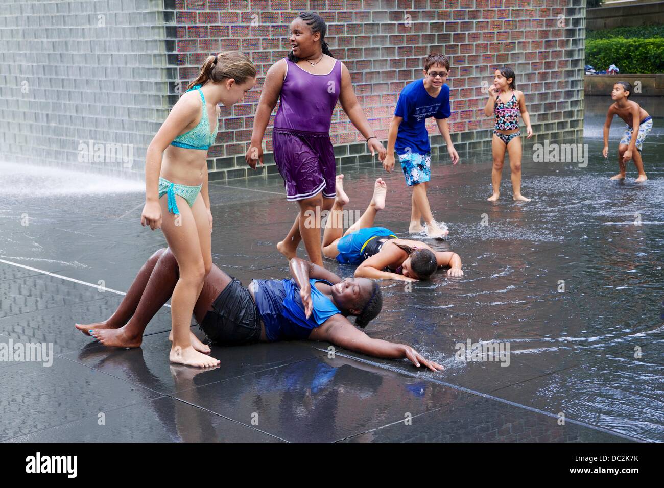 Chicago, Illinois, USA. 7th August 2013. Crown Fountain in Millennium Park in Chicago, USA, provides cool fun for children on a hot, muggy day. Credit:  Todd Bannor/Alamy Live News Stock Photo