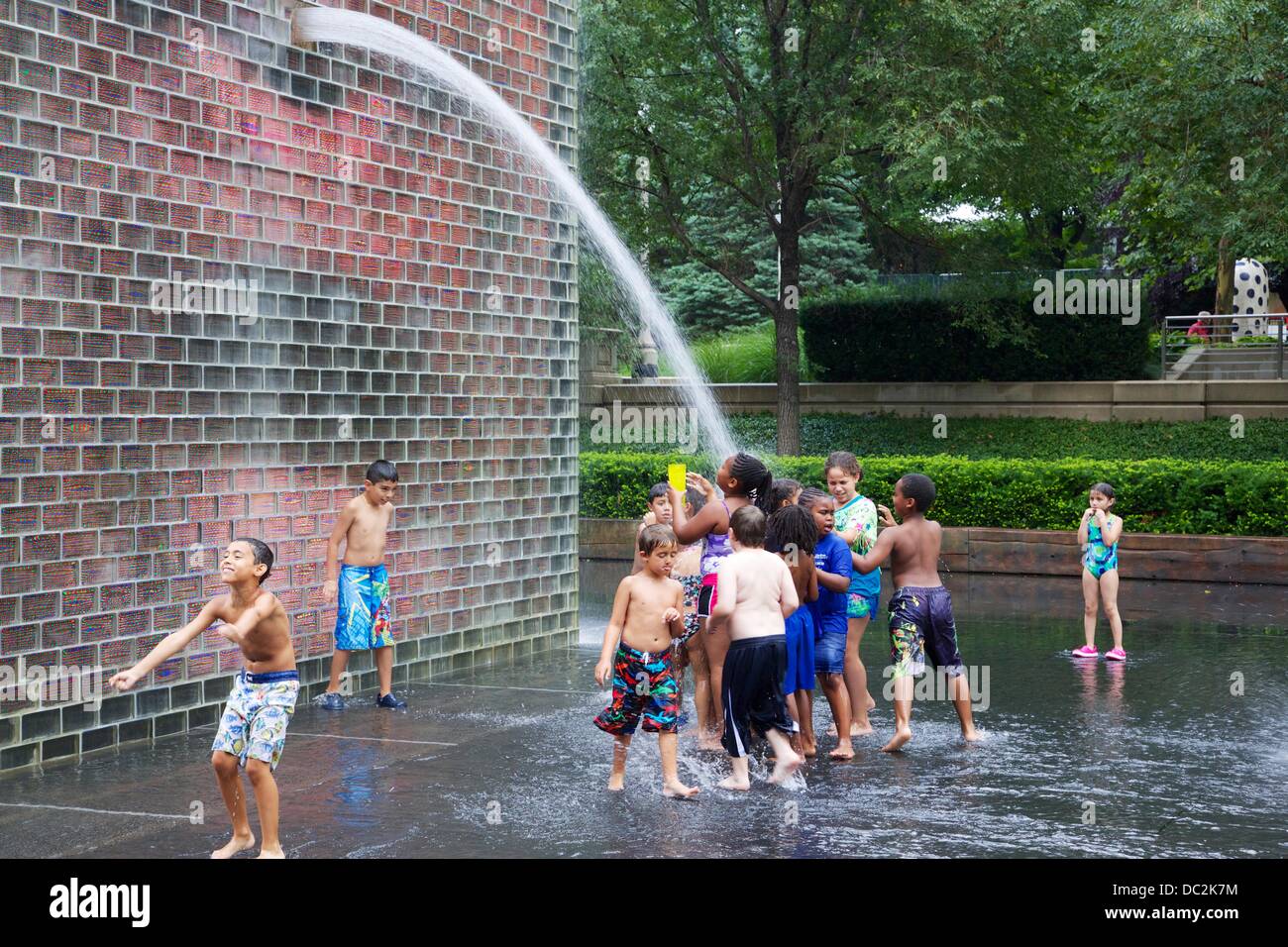 Chicago, Illinois, USA. 7th August 2013. Crown Fountain in Millennium Park in Chicago, USA, provides cool fun for children on a hot, muggy day. Credit:  Todd Bannor/Alamy Live News Stock Photo
