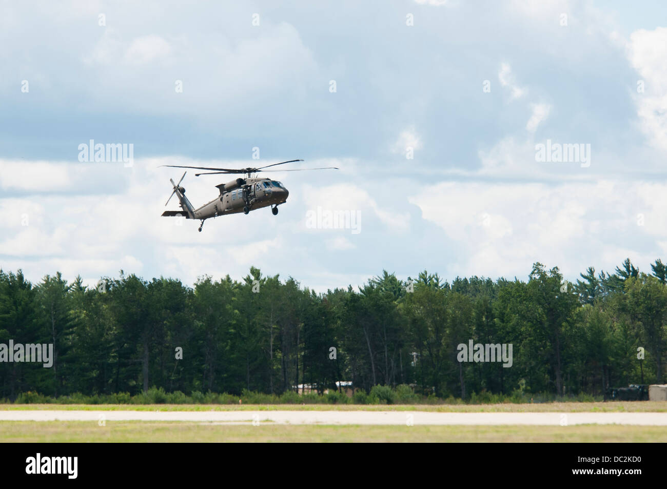 UH-60M Black Hawks from the 3-238 General Support Aviation Battalion from Grand Ledge, Michigan lands at Grayling Air Field, Grayling, Michigan, Aug. 3, 2013. The 3-238th are participating in Exercise Northern Strike 2013 a joint multinational combined ar Stock Photo