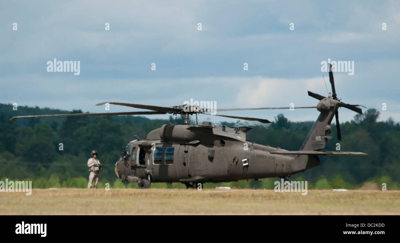 UH-60M Black Hawks from the 3-238 General Support Aviation Battalion from Grand Ledge, Michigan lands at Grayling Air Field, Grayling, Michigan, Aug. 3, 2013. The 3-238th are participating in Exercise Northern Strike 2013 a joint multinational combined ar Stock Photo