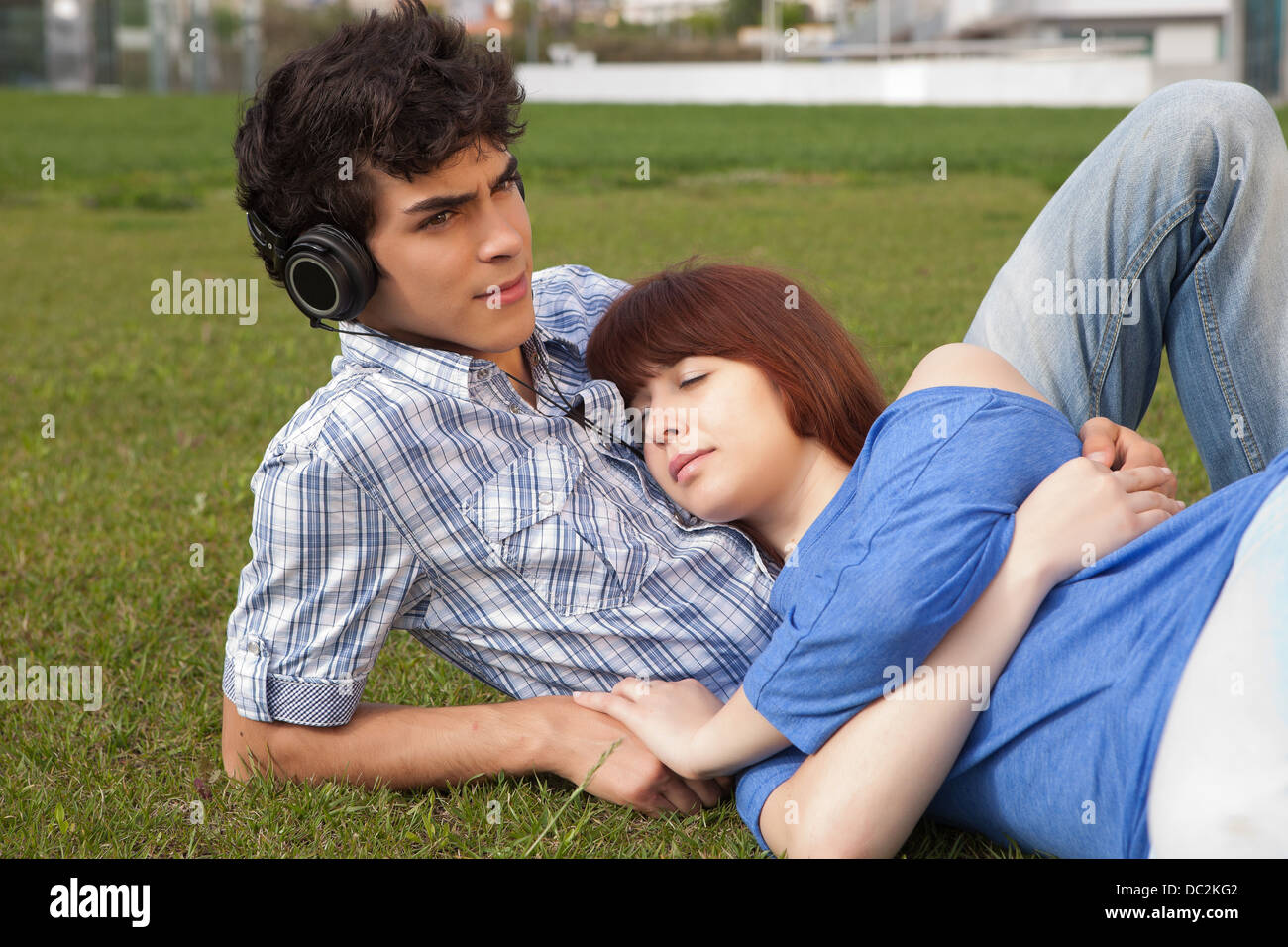 Young happy couple at the park Stock Photo - Alamy
