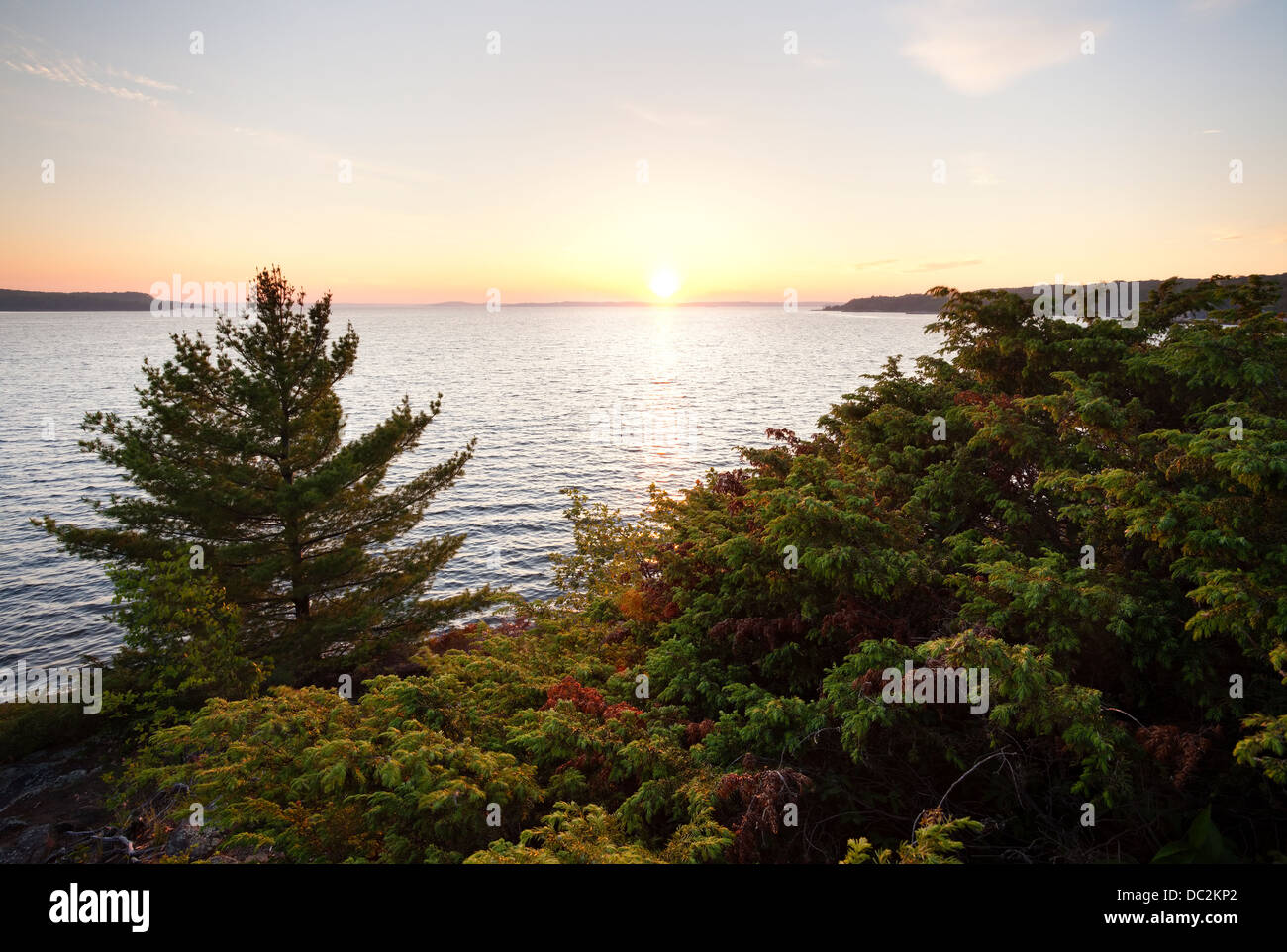 The setting sun over Georgian Bay, Parry Sound, Ontario, Canada. Stock Photo