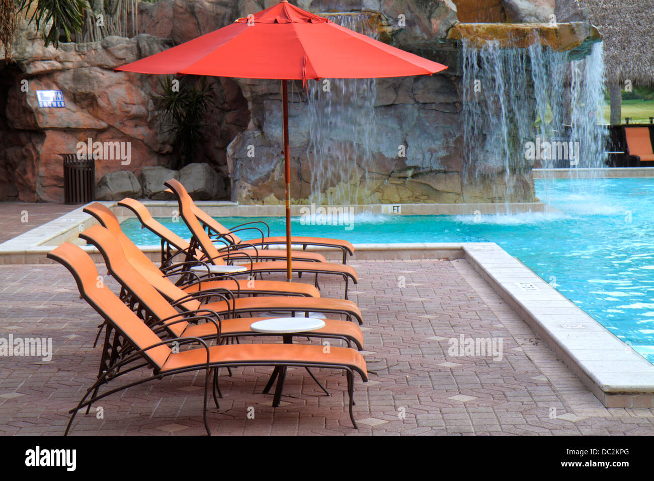 Florida Weston,Fort Ft. Lauderdale,Bonaventure Resort & Spa,hotel,swimming pool area,lounge chairs,umbrella,artificial man-made waterfall,looking FL13 Stock Photo