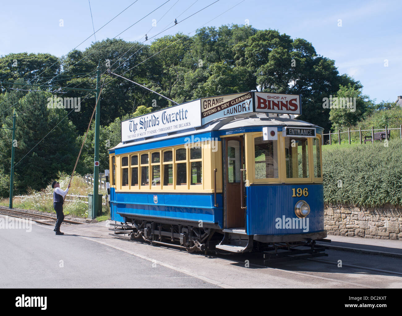 Driver reverses trolley pole on vintage tram, Beamish museum, north east England, UK Stock Photo