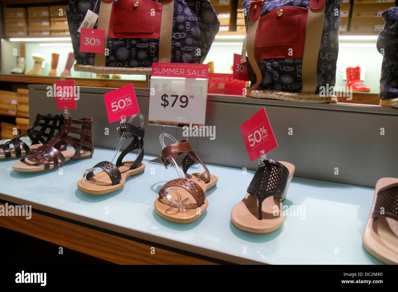 Florida Sunrise,Fort Ft. Lauderdale,Sawgrass Mills mall,interior  inside,sale,UGG,women's,shoes,sign,50% discount off,reduced  pricing,price,discount,re Stock Photo - Alamy