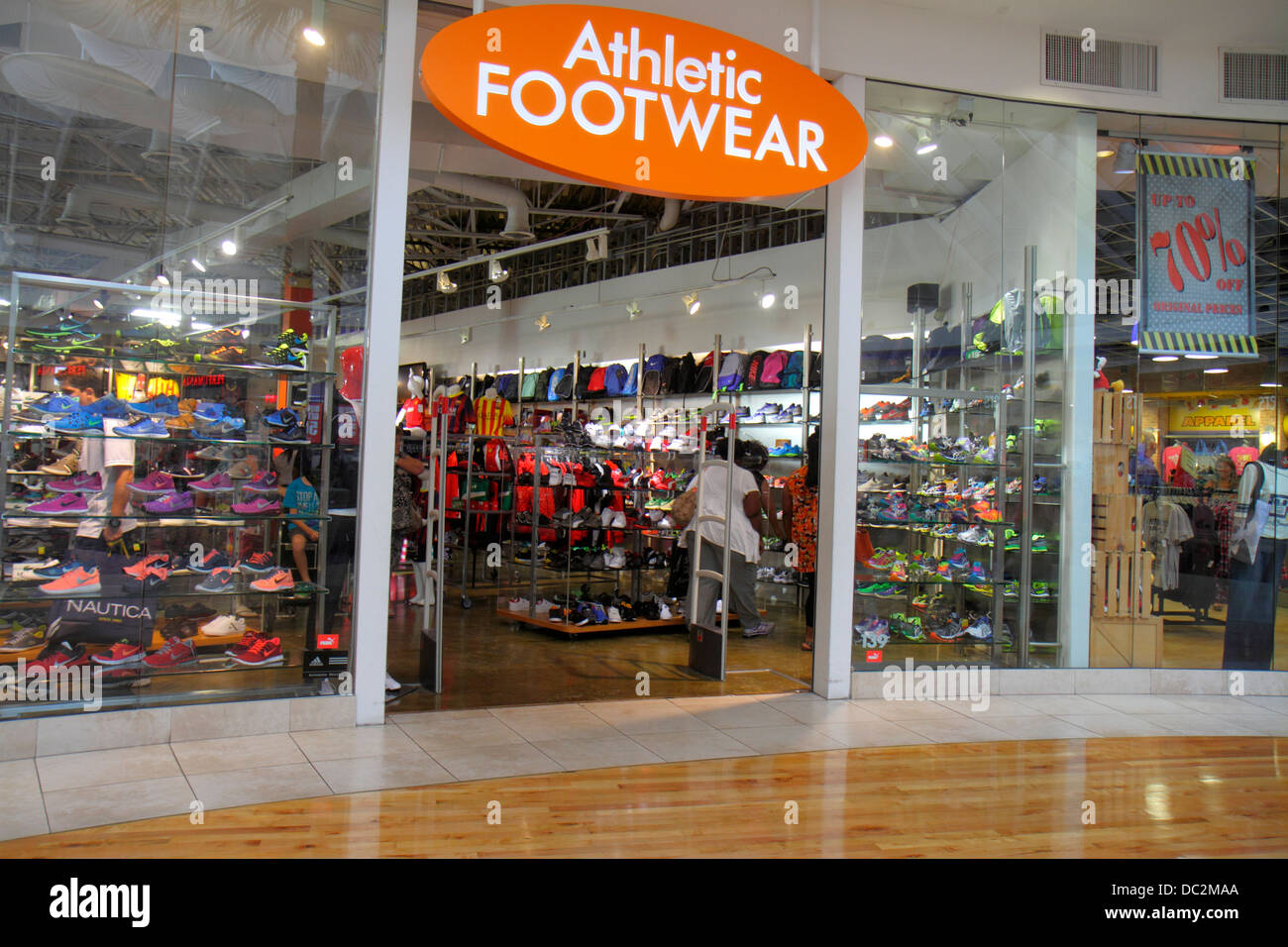 Florida Sunrise,Fort Ft. Lauderdale,Sawgrass Mills mall,sale,display sale front,entrance,Athletic Footwear,shoe store,looking FL130731119 Stock Photo