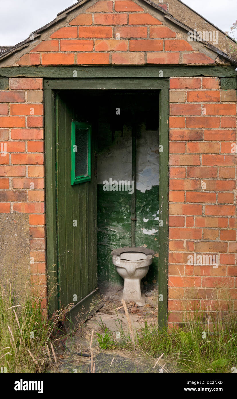 Old outside toilet in outhouse, England Stock Photo