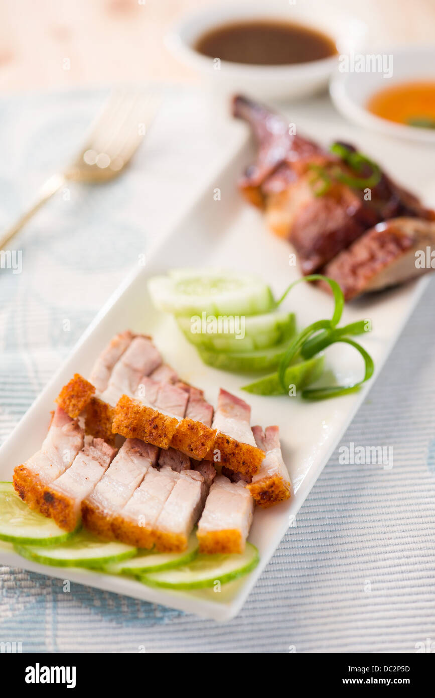 Siu Yuk, Chinese crispy roasted belly pork with duck at the back close up shot Stock Photo