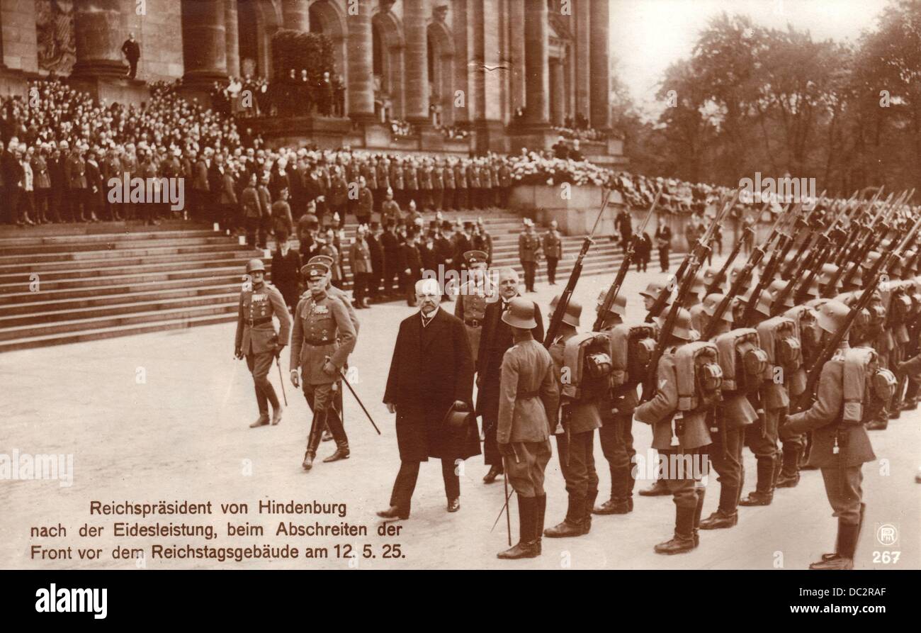 The historical postcard shows Reich President Paul von Hindenburg at the reception with military honours before being sworn in, in front of the Reichstag in Berlin, Germany, on 12 May 1925. Fotoarchiv für Zeitgeschichte Stock Photo