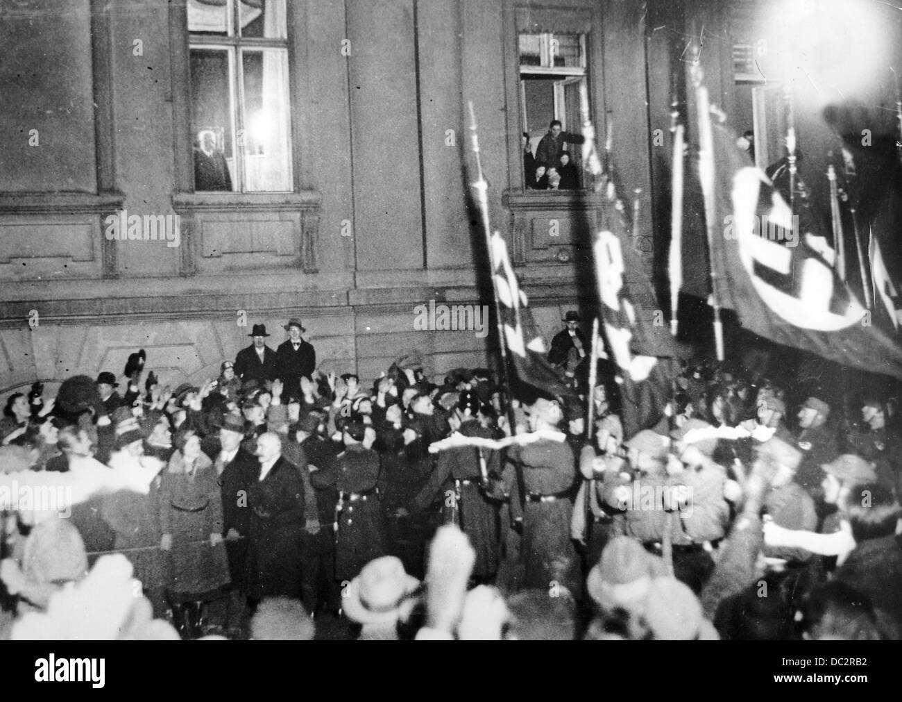 Reich President Paul von Hindenburg is pictured at the window of the Reich Chancellery in Berlin, Germany, on the night, on which Adolf Hitler was sworn into office as Reich Chancellor, 30 January 1933. The 'national associations' SA, SS, and Stahlhelm celebrate the 'seizure of power' by Hitler with a torch parade through the city centre of Berlin. Fotoarchiv für Zeitgeschichte Stock Photo