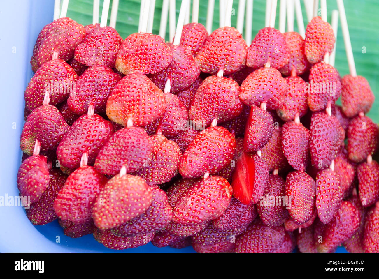Strawberry on a banana leaf Stock Photo Alamy
