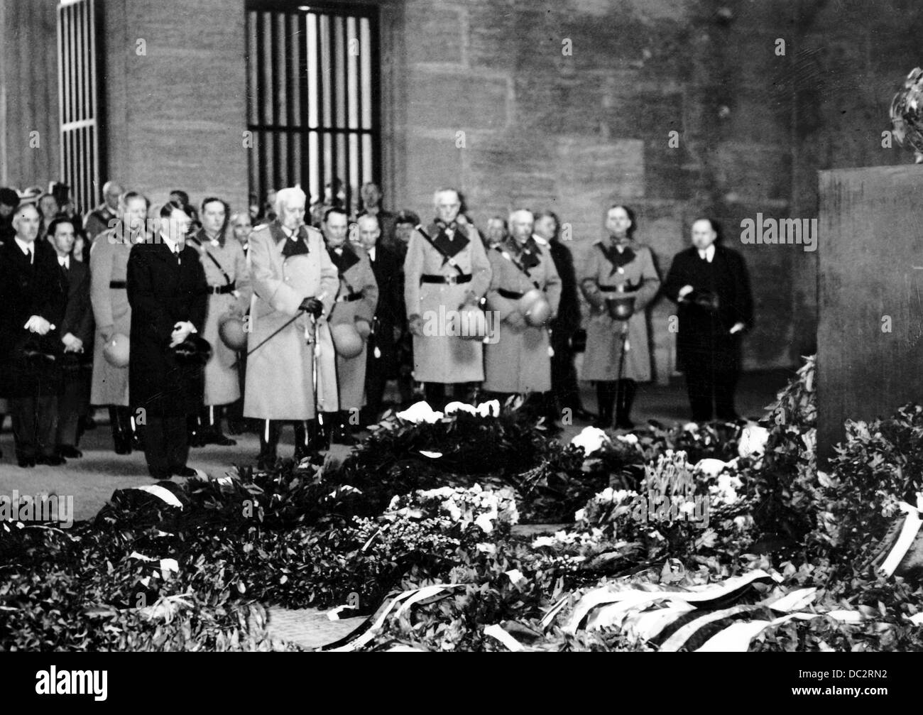 Reich President Paul von Hindenburg (m) is pictured next to Reich Chancellor Adolf Hitler (l) at Neue Wache in Berlin, Germany, on the Day of Commemoration of Heroes on 25 February 1934. In the background to the left, Vice Chancellor Franz von Papen, 2-l Reich Minister Joseph Goebbels. To the right next to Hindenburg, Reich Minister Hermann Göring. Fotoarchiv für Zeitgeschichte Stock Photo