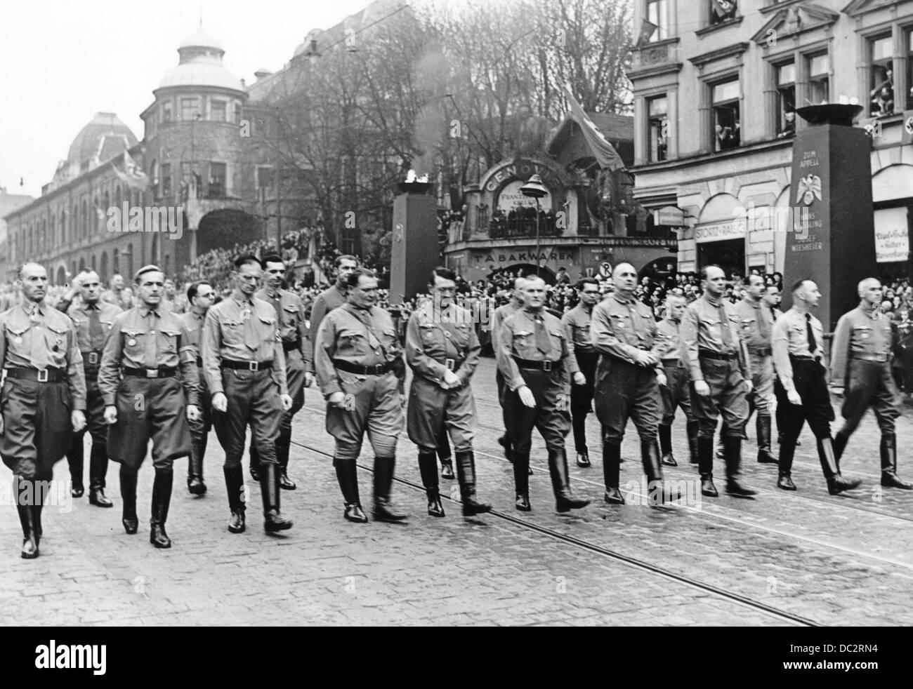 Adolf Hitler (m), Hermann Göring (4-l) and Ulrich Graf (6-l) march towards the Feldherrenhalle to commemorate the Beer Hall Putsch of November 1923 in Munich, Germany, 9 November 1938. On that same night, Joseph Goebbels initiated the Reichskristallnacht (Night of Broken Glass) with his speech in the Old City Hall. The Nazi Propaganda! on the back of the image is dated 9 November 1938: '9 November in Munich - The historical march. The Führer group, next to the Führer, Hermann Göhring and Ulrich Graf.' Fotoarchiv für Zeitgeschichte Stock Photo