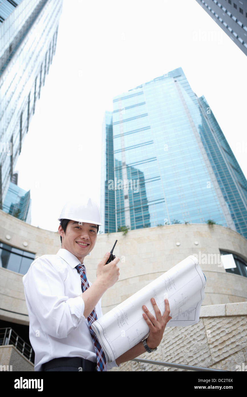 construction working in front of office buildings Stock Photo Alamy
