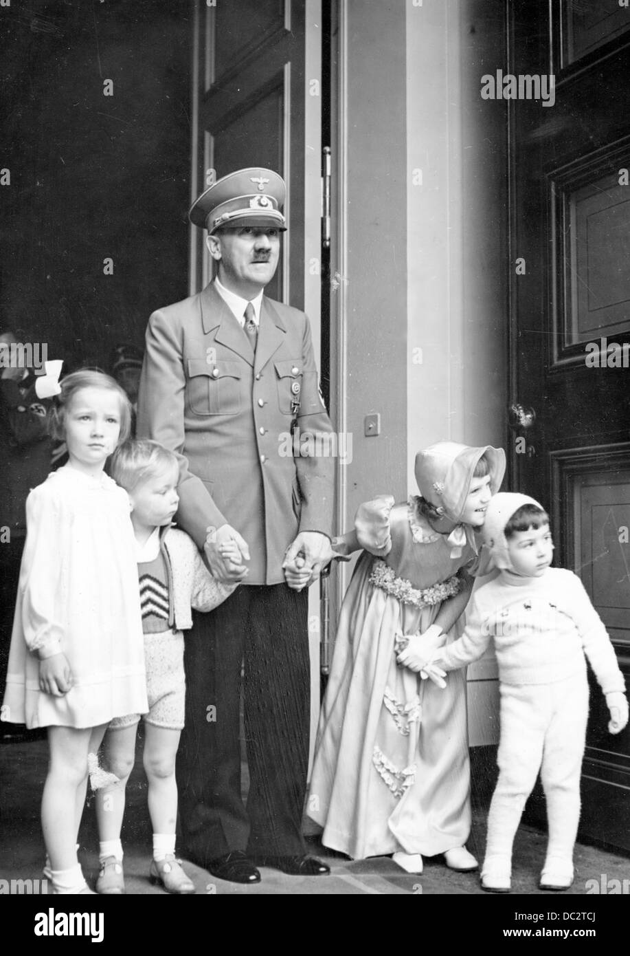 The Nazi Propaganda! image shows Adolf Hitler on his 50th birthday with children, who congratulated him, at the entrance of the Neue Reich Chancellery in Berlin, Germany, 20 April 1939. Fotoarchiv für Zeitgeschichte Stock Photo