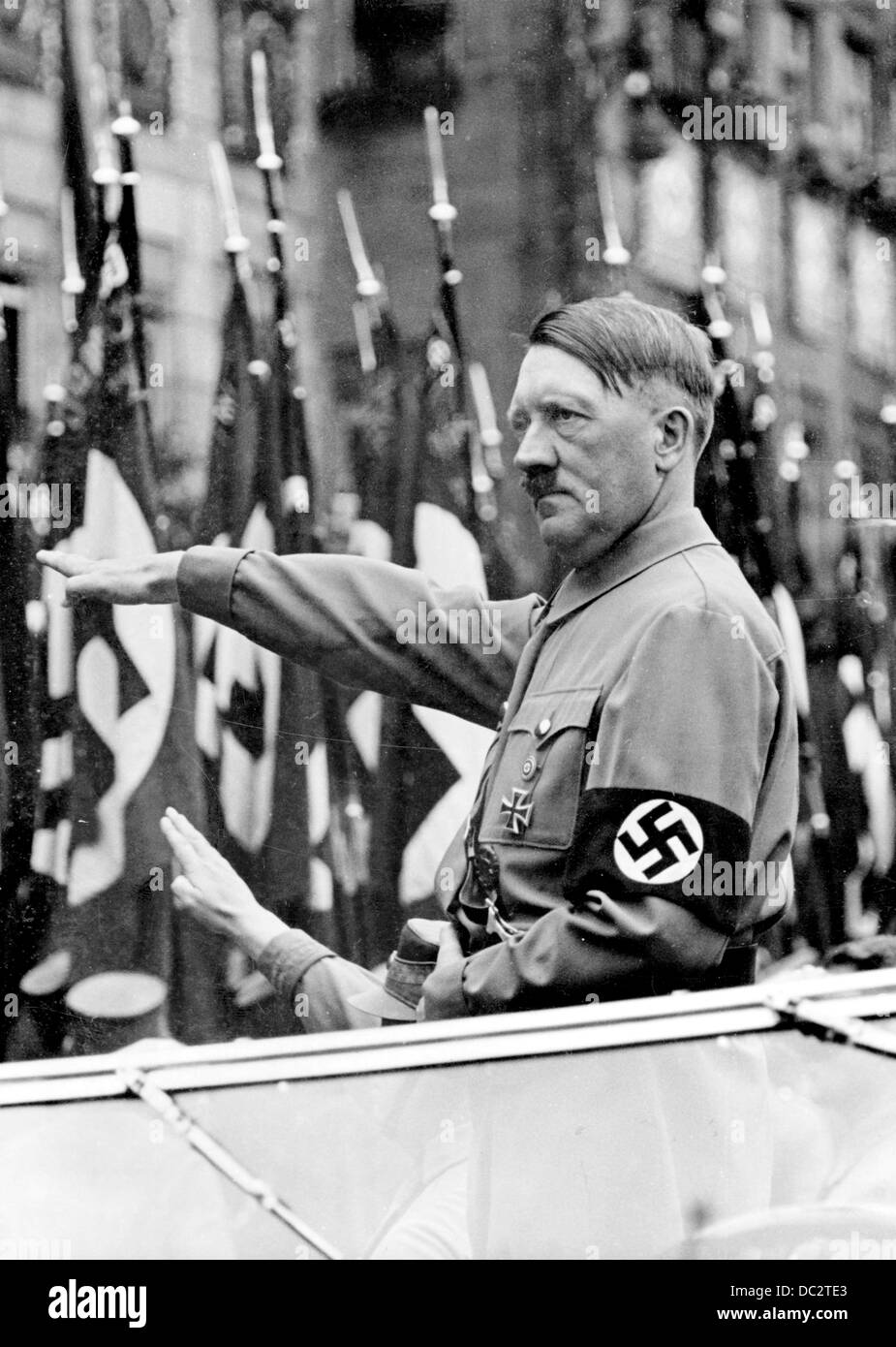 The Nazi Propaganda! image shows Adolf Hitler saluting members of the SA, SS, NSKK, and NSFK, which march past him during the Nuremberg Rally in Nuremberg, Germany, from 6 - 13 September 1937. Fotoarchiv für Zeitgeschichte Stock Photo