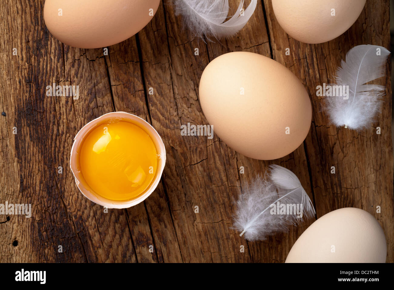 Fresh eggs on wood background. Top view Stock Photo