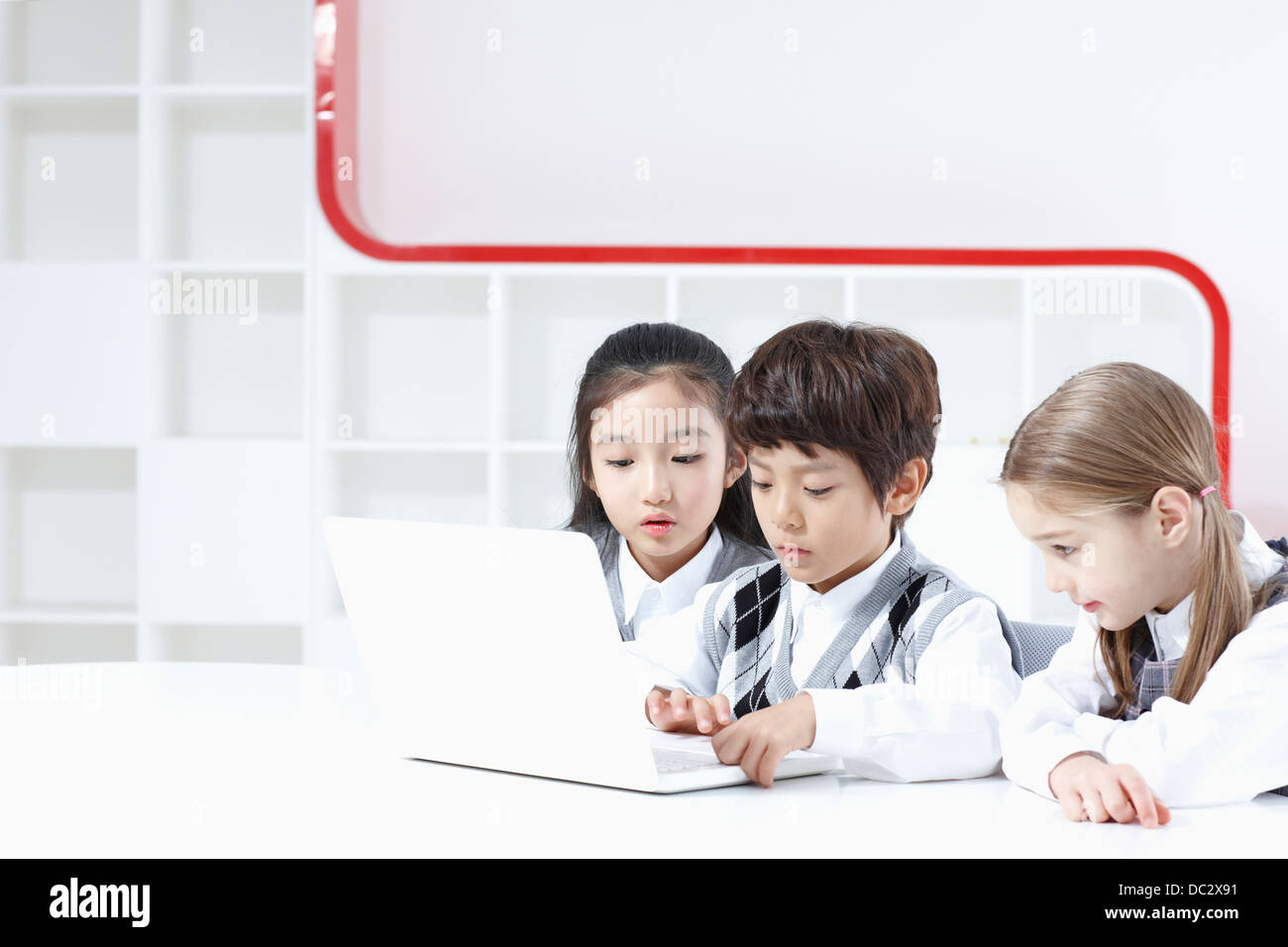 kids using a laptop together Stock Photo - Alamy