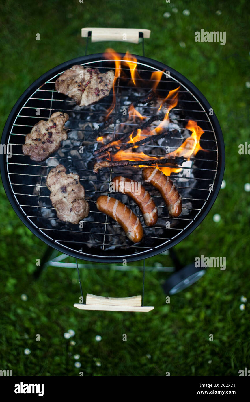 Cooking on the barbecue grill Stock Photo Alamy