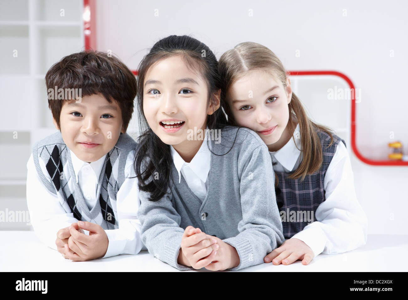 kids smiling in front of camera together Stock Photo - Alamy