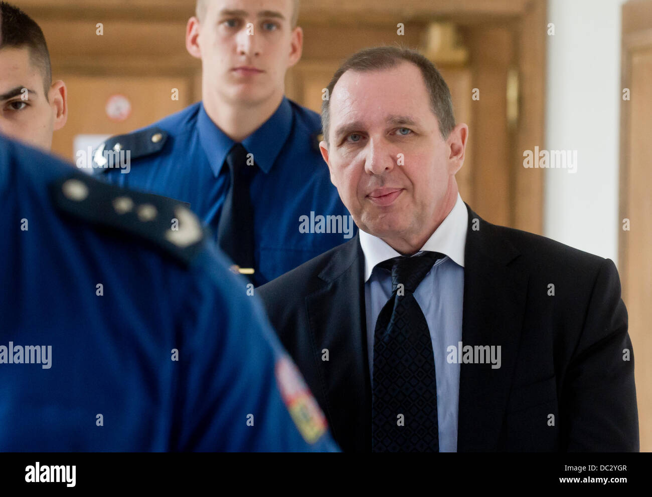 Prague, Czech Republic. 8th Aug, 2013. Former politician Petr Kott, right, is seen during a break at the Prague Regional Court, where continues the trial in David Rath case, in Prague, Czech Republic, August 8, 2013. David Rath and ten other people are charged with corruption and manipulation of public tenders. Rath has been in custody since May 2012 when the police caught him with seven million crowns. Rath faces up to 12 years in prison. Credit:  Vit Simanek/CTK Photo/Alamy Live News Stock Photo
