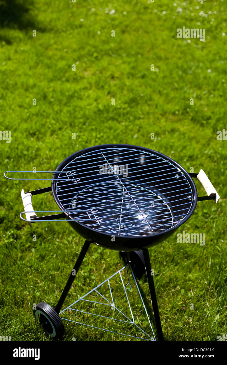 Grill on green grass Stock Photo Alamy