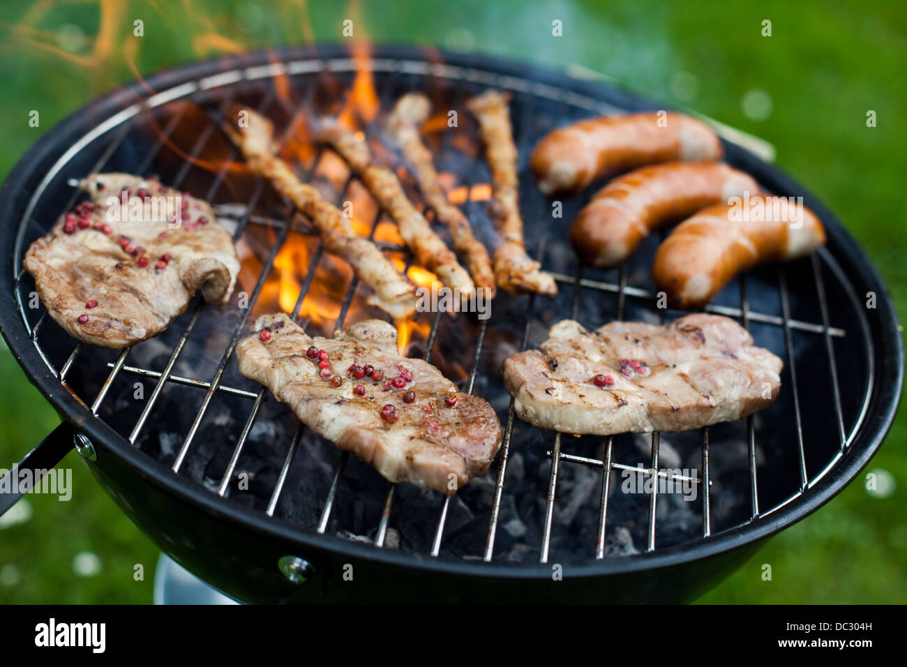 Closeup of meat on grill Stock Photo - Alamy