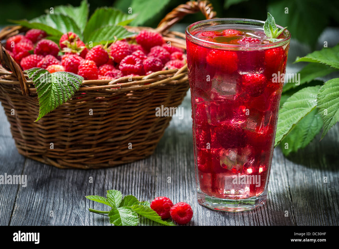 Juice of fresh raspberries served with ice in a glass Stock Photo - Alamy