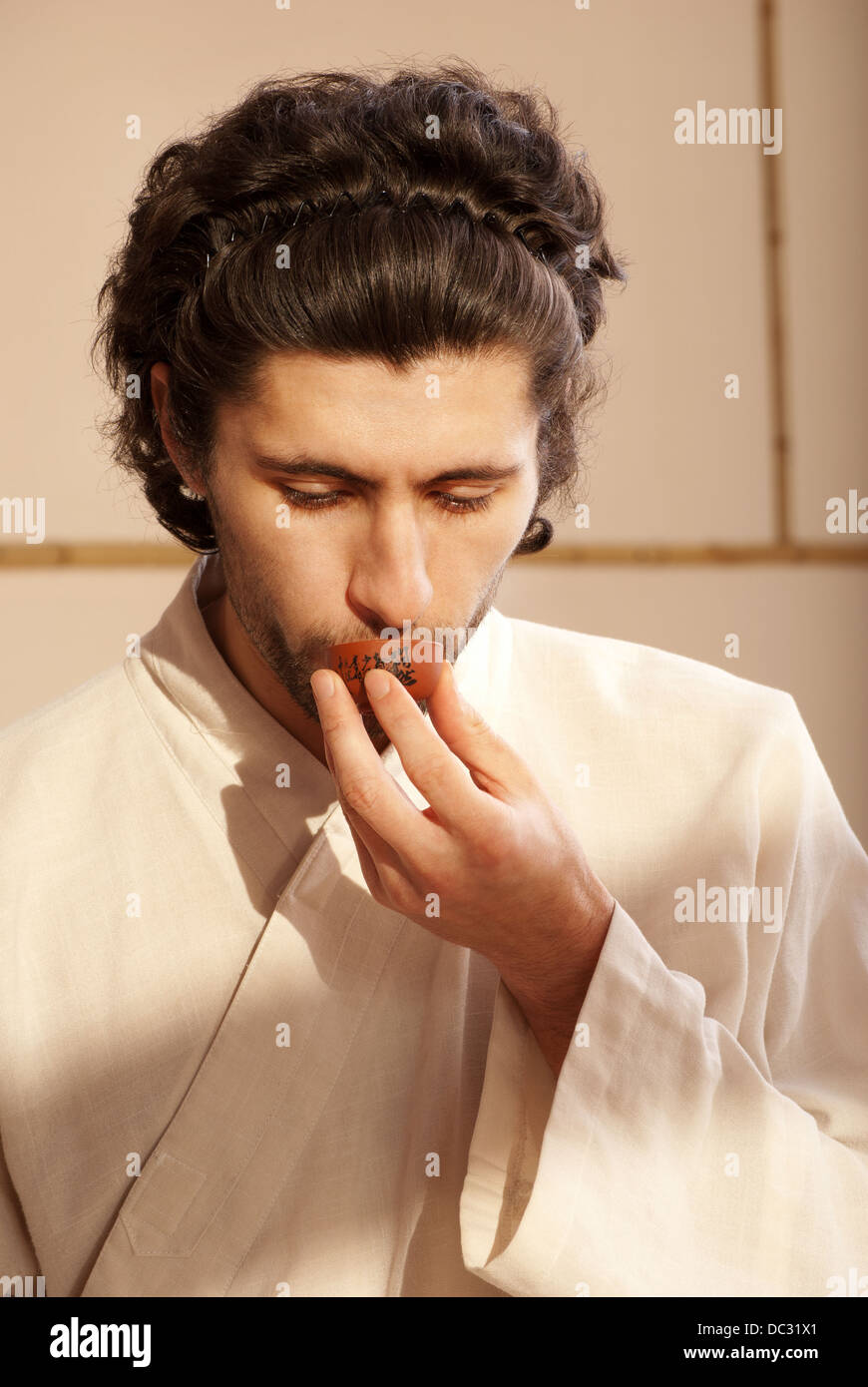 Chinese tea ceremony is perfomed by tea master in kimono Stock Photo