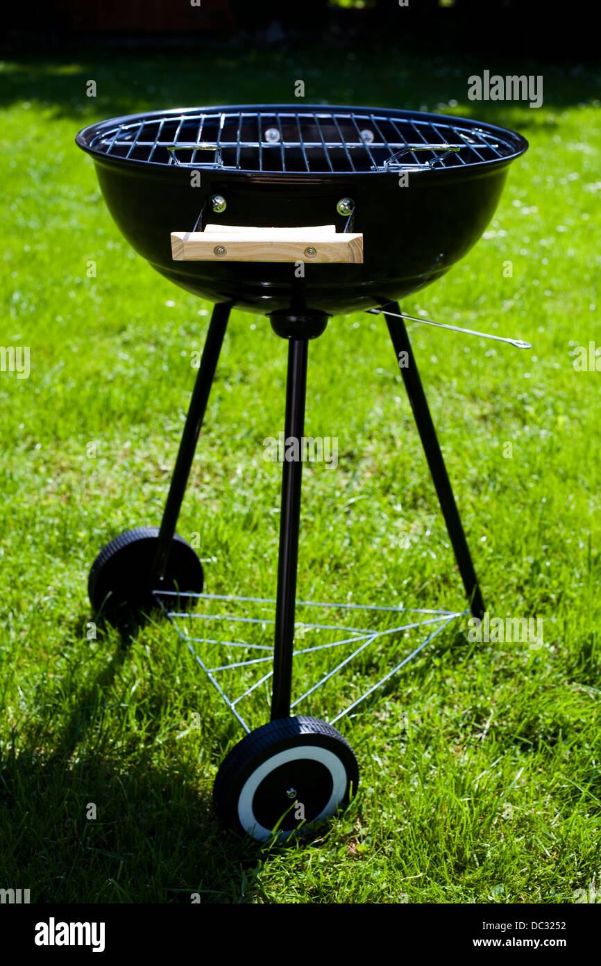 Grill on green grass Stock Photo Alamy
