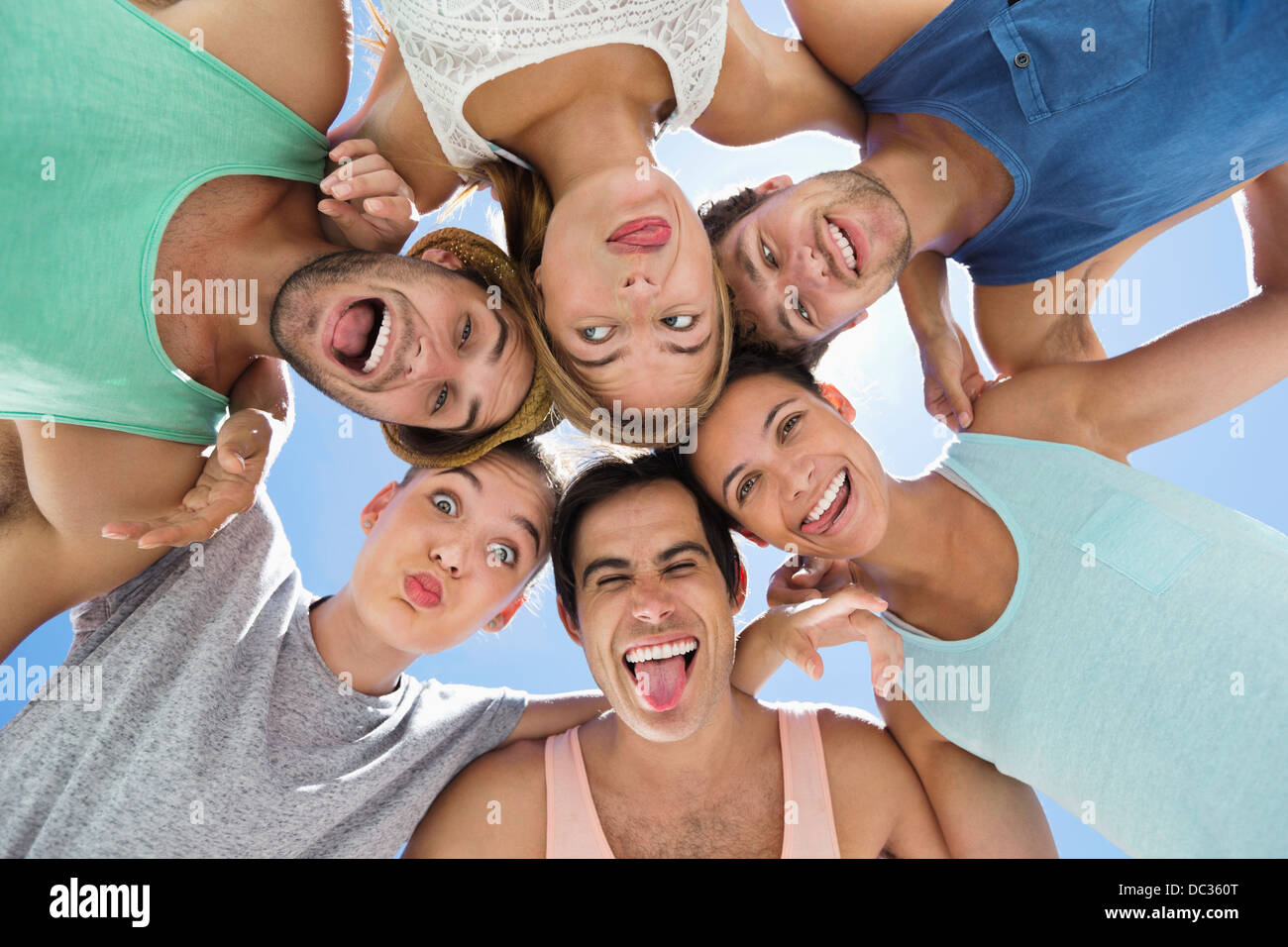 Low angle portrait of friends making silly faces Stock Photo