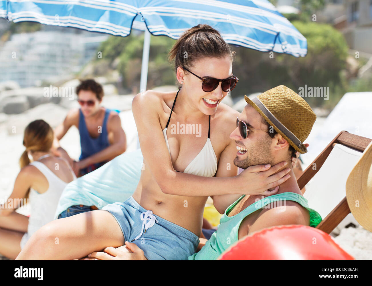 Happy couple hugging on beach Stock Photo