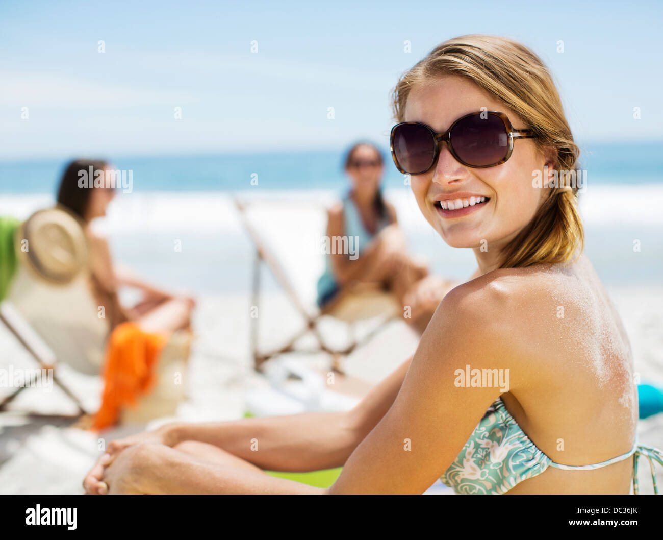 Portrait of smiling woman at beach Stock Photo - Alamy