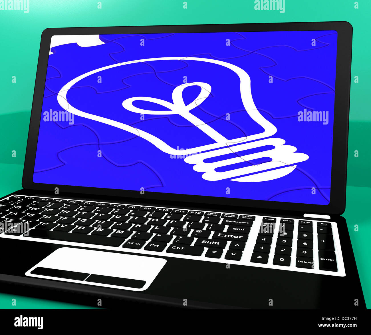 Bulb Puzzle On Notebook Showing Computer Energy Stock Photo - Alamy