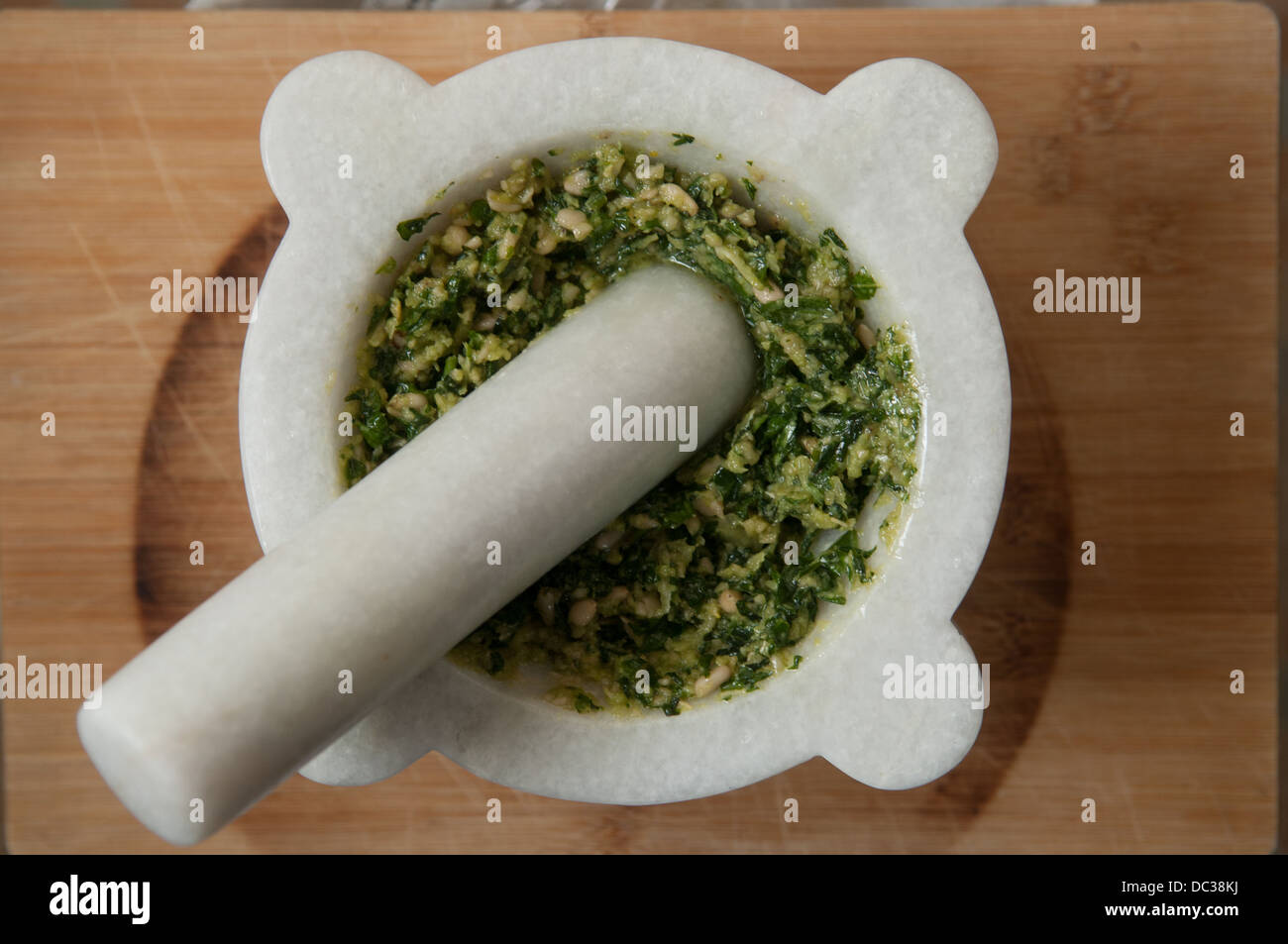 Pesto prepared in a pestle and mortar Stock Photo Alamy