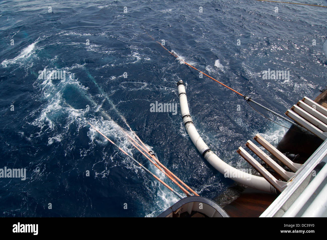 Offshore seismic air guns been picked up to seismic vessel Stock Photo