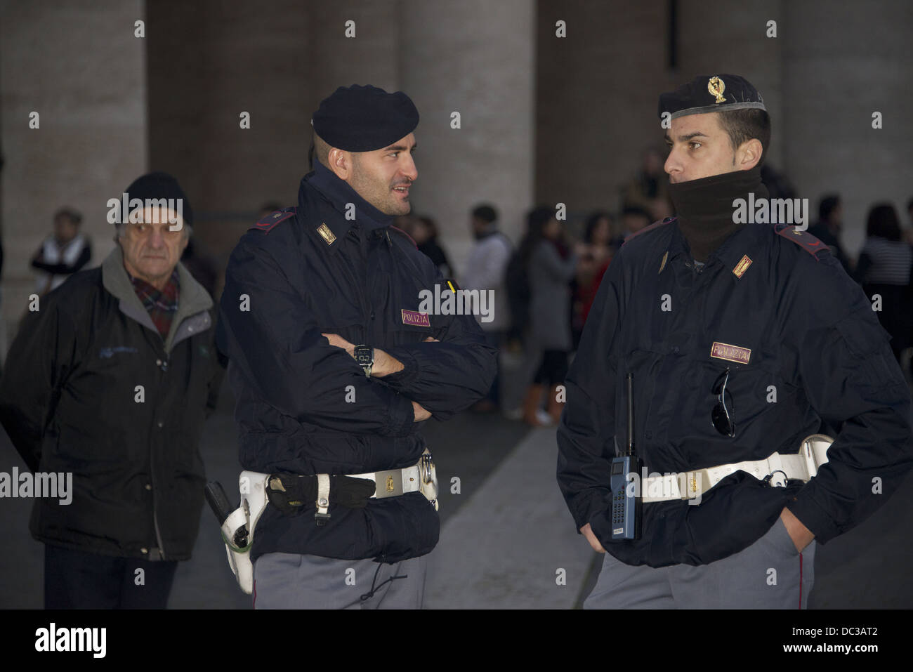 Two police officers guarding the entrance to St. Peter's Basilica in ...