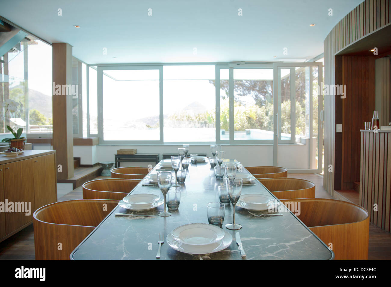 Place settings on table in luxury dining room Stock Photo