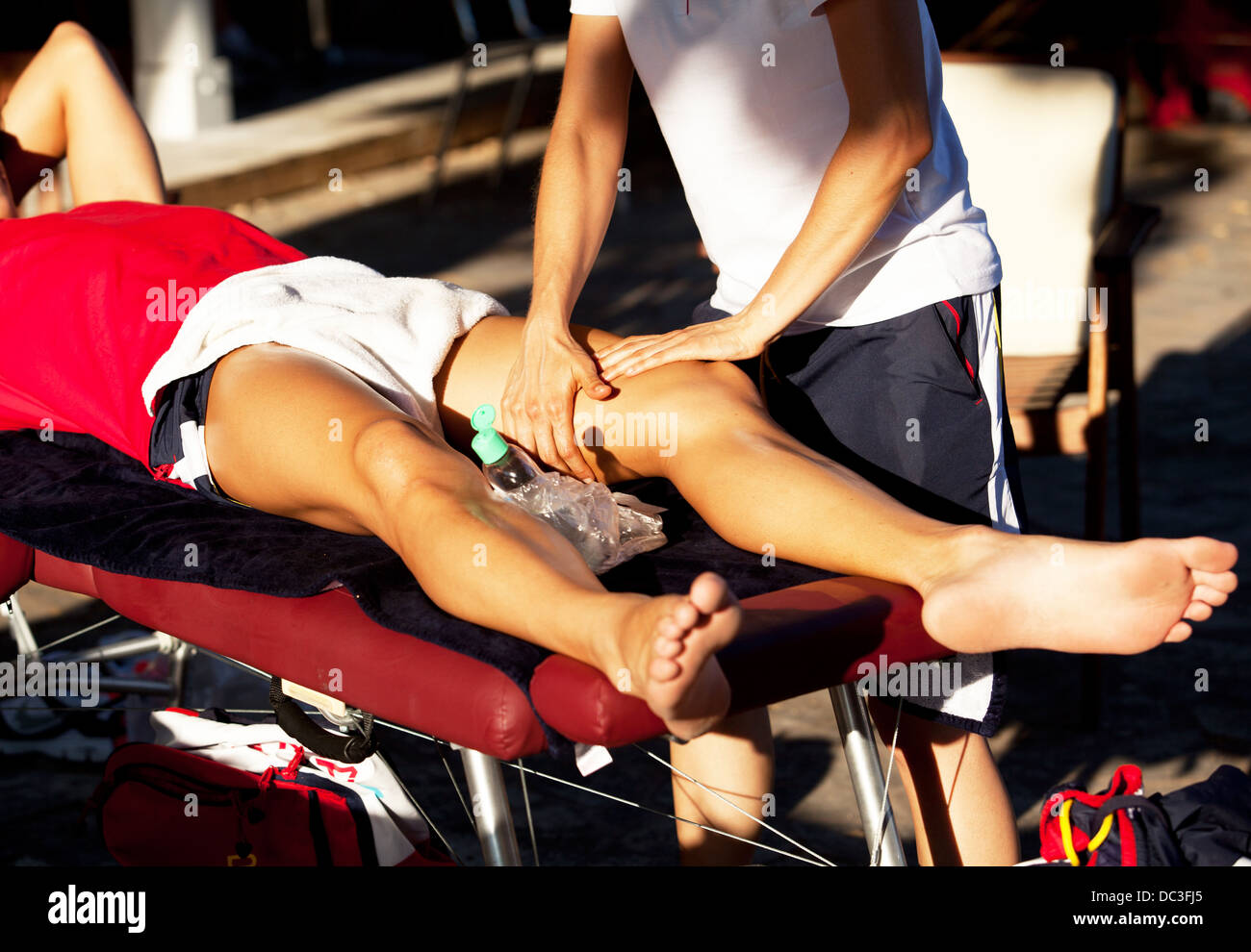 therapist giving a leg massage Stock Photo
