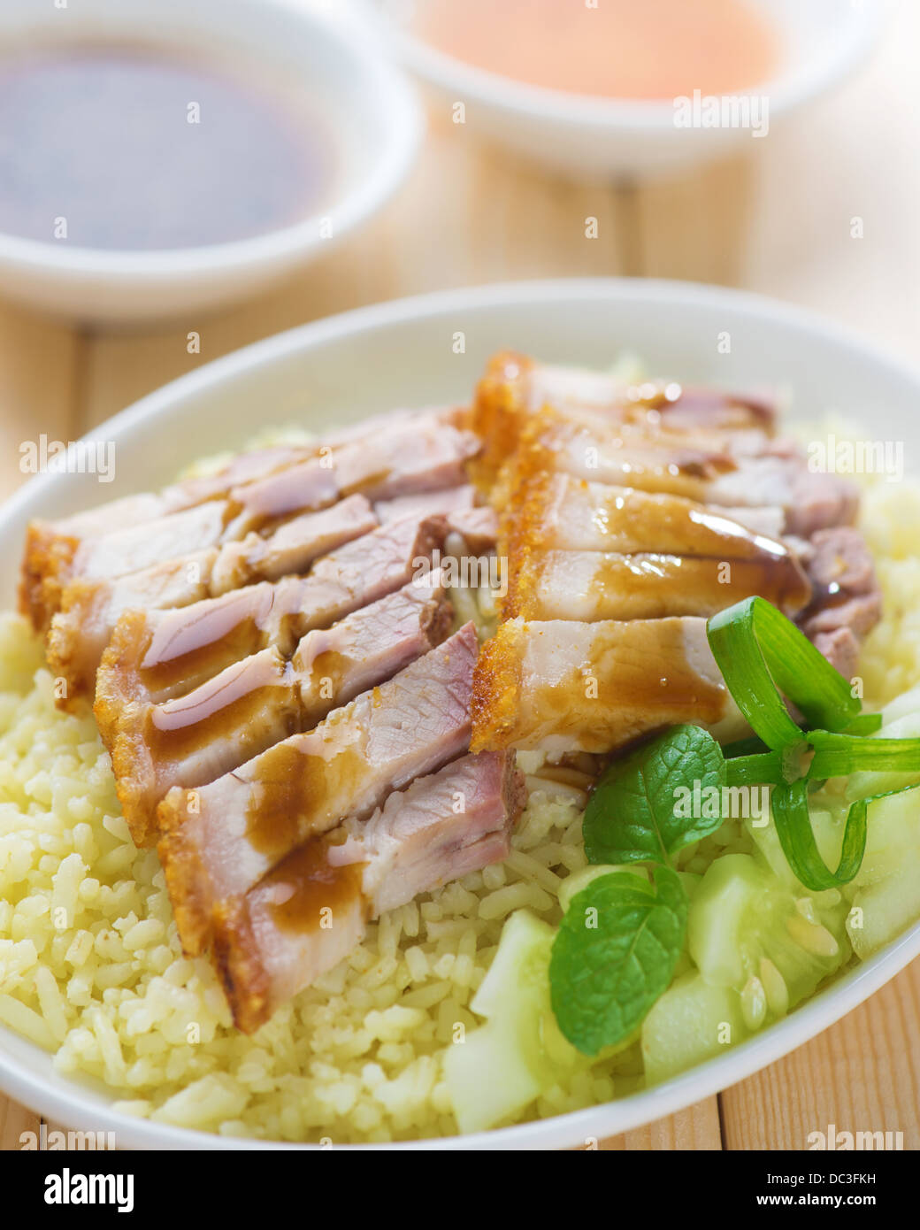 Siu Yuk or sliced Chinese boneless roast pork with crispy skin, serve with steamed rice. Singapore Chinese cuisine. Stock Photo