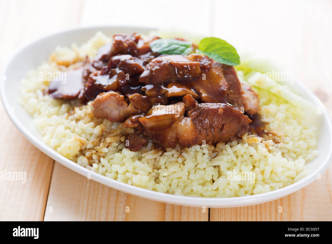 Char Siu - Chinese sticky pork spare ribs roasted with a sweet and savory sauce served with boiled rice. Barbecued pork Char Siu Rice Malaysia cuisine. Stock Photo