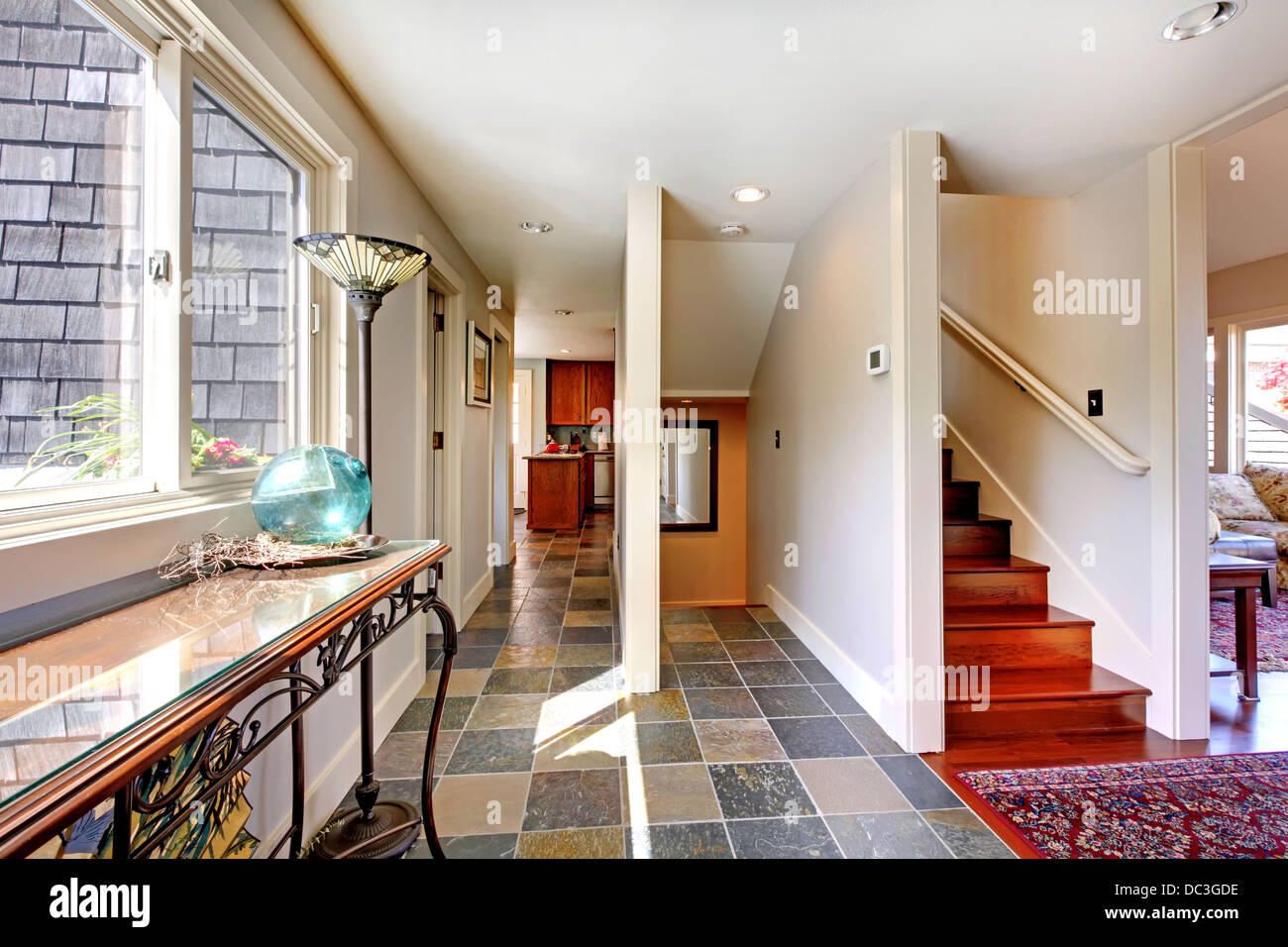 Home large hallway with stairs and window Stock Photo - Alamy